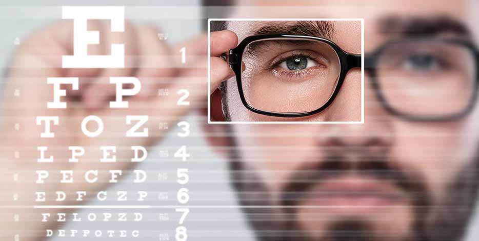 Man wearing glasses completing eye test
