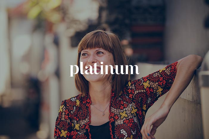 Middled aged woman with Platinum Magazine logo superimposed on top.