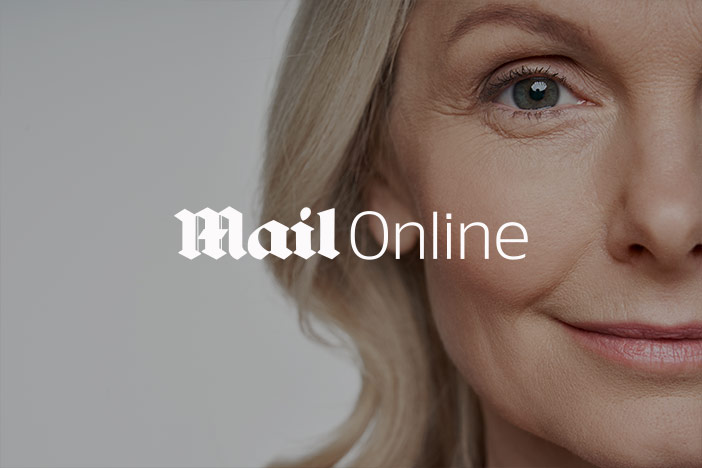 An older woman woman stares into the camera with the Mail Online logo superimposed on top
