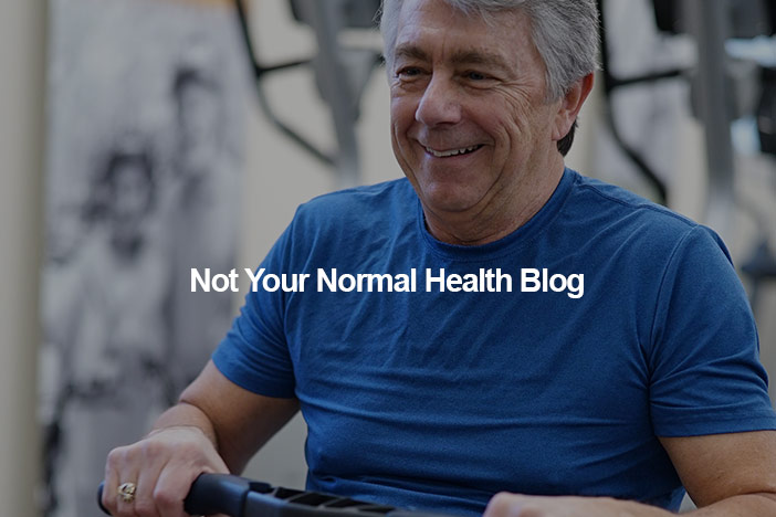 An older gentleman uses an exercise machine at the gym. The Not Your Normal Health Blog logo is superimposed on top.