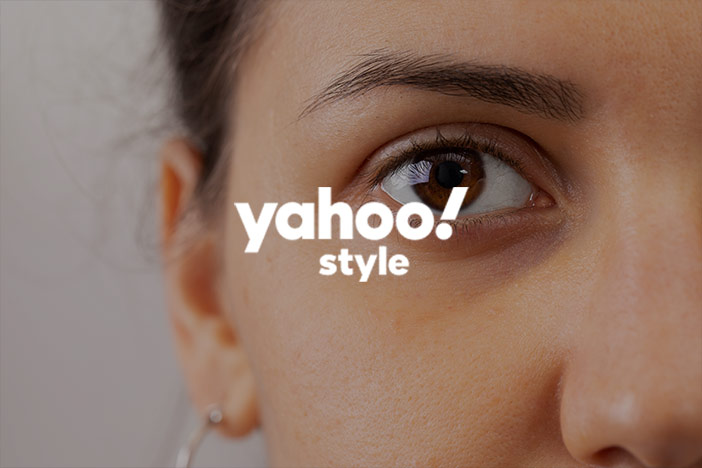 A woman with slight dark circles under the eyes. A 'Yahoo! Style' logo is superimposed on top.