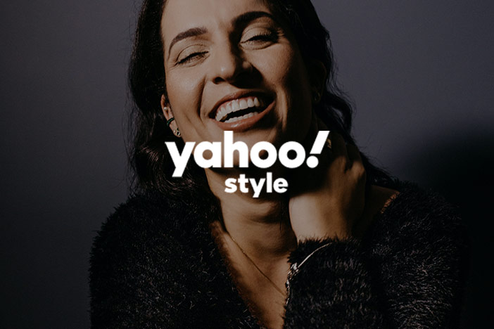 Older woman in her 40s profile smiling happy with Yahoo! Style logo imposed 