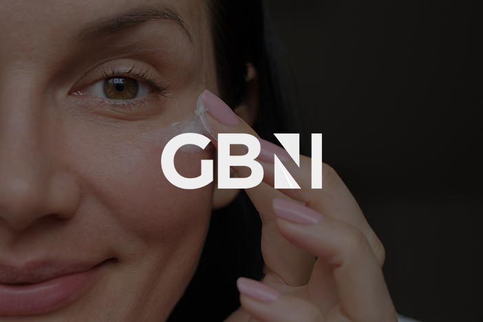 Close-up of a woman applying cream under her eye with the logo of 'GB News' overlaid on the image.