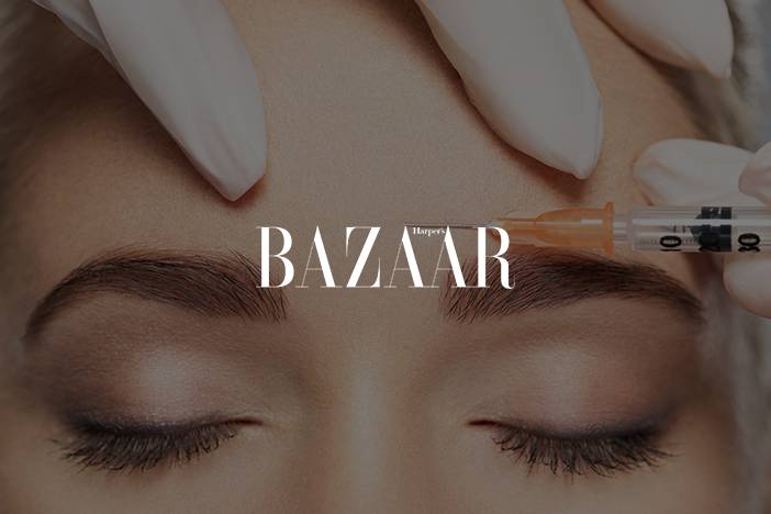 Dr Elizabeth Hawkes discussing cosmetic injections in Harper’s Bazaar Close-up of forehead receiving cosmetic injection treatment, featured in Harper’s Bazaar article on aesthetic procedures