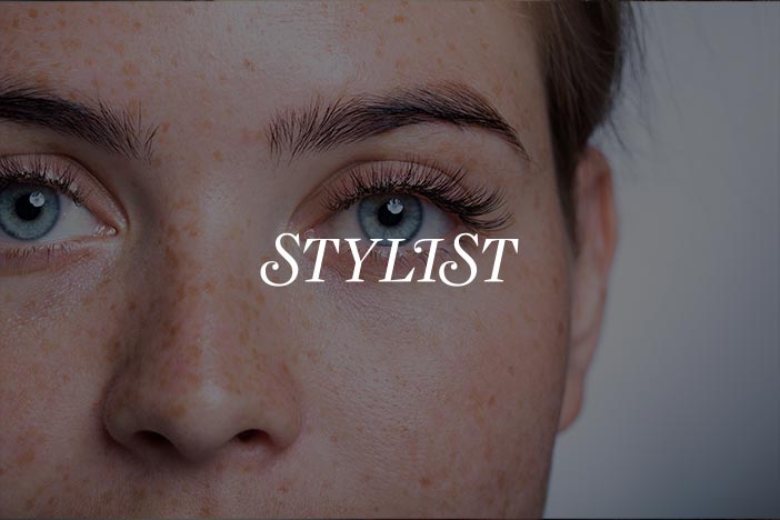 Close-up of a woman's orbital eye area with natural skin, featuring the text "Stylist" overlaid