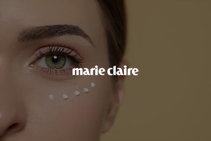 Marie Claire feature on under-eye skincare routine Close-up of a woman’s eye with under-eye cream dots applied