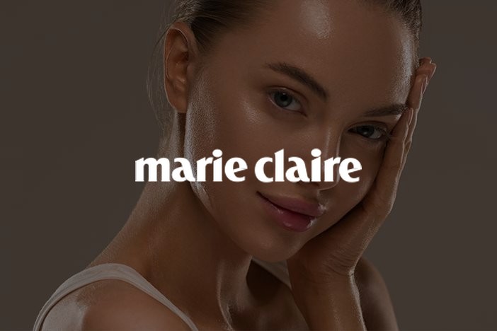 Woman with glowing skin touching her face, Marie Claire UK Skin Awards 2026
