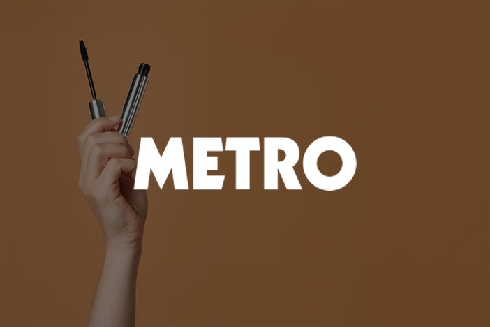 Hand holding up a mascara wand, Metro shopping round-up