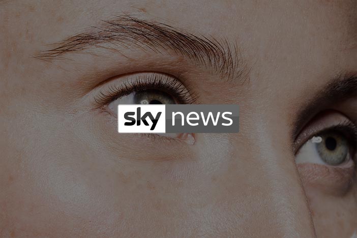 Close-up of a person's eyes and skin with Sky News logo overlayed