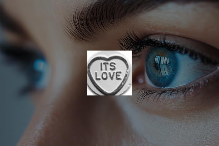 Close-up of eyes with an “It’s Love” sweet overlay