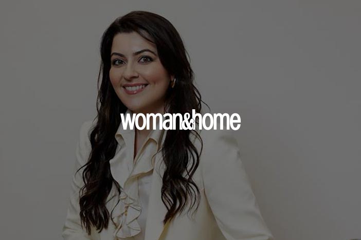  Portrait of Dr Elizabeth Hawkes smiling in cream suit, featured in Woman & Home as a skincare awards judge