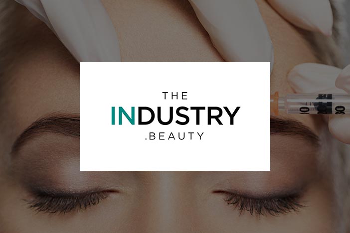 Close-up of a woman receiving an aesthetic injection above the eyebrow featured in The Industry Beauty article on regulations