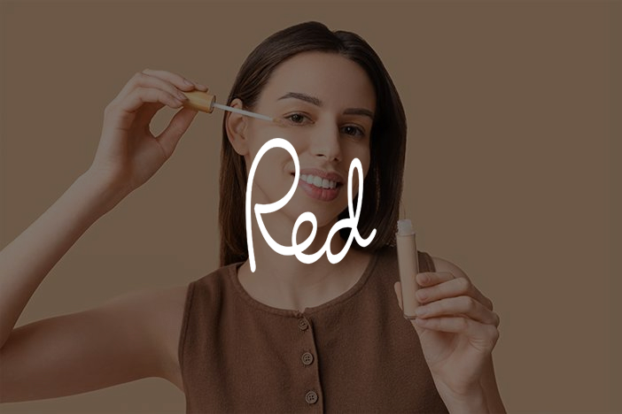 Red magazine - Dr Elizabeth Hawkes on eyelash serums Woman applying mascara wand to lashes in mirror, Red magazine feature on eyelash serums