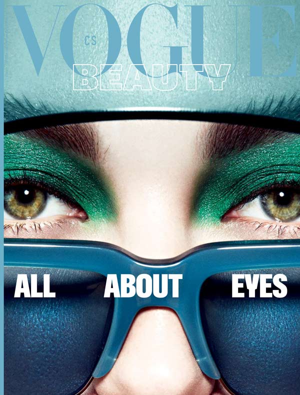 Vogue Beauty magazine cover featuring close up of green eyes with green eyeshadow and blue designer sunglasses